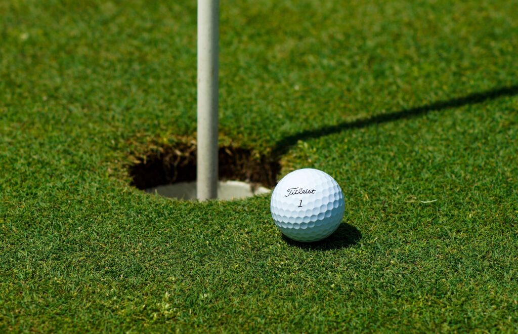 Golf Ball at Cup and Pin