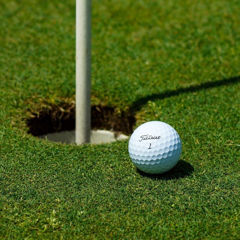 Golf Ball at Cup and Pin